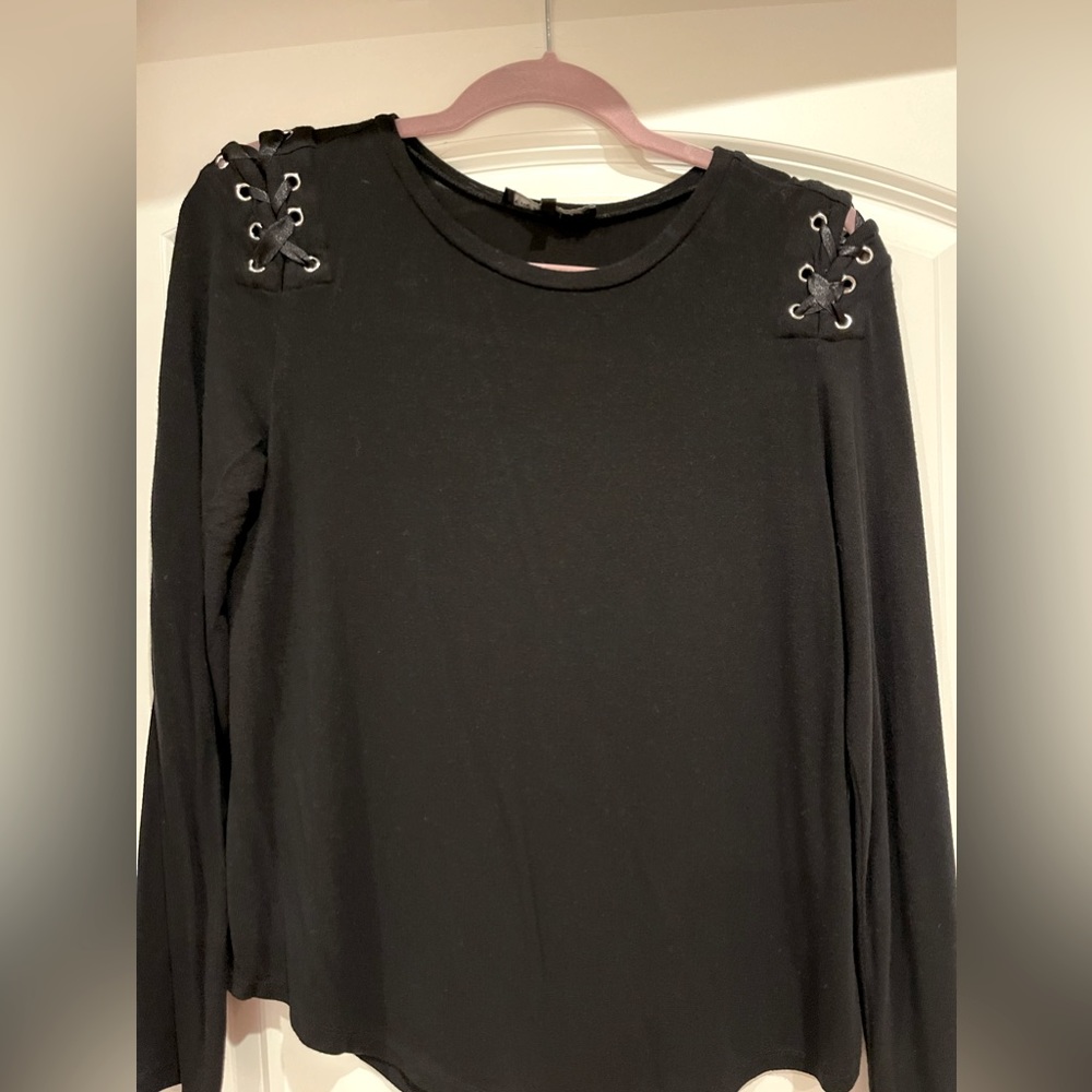 Generation Love top with a ribbon detail on the back. Gently used.